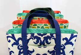 Four tote bags made of colorful patterned cloth