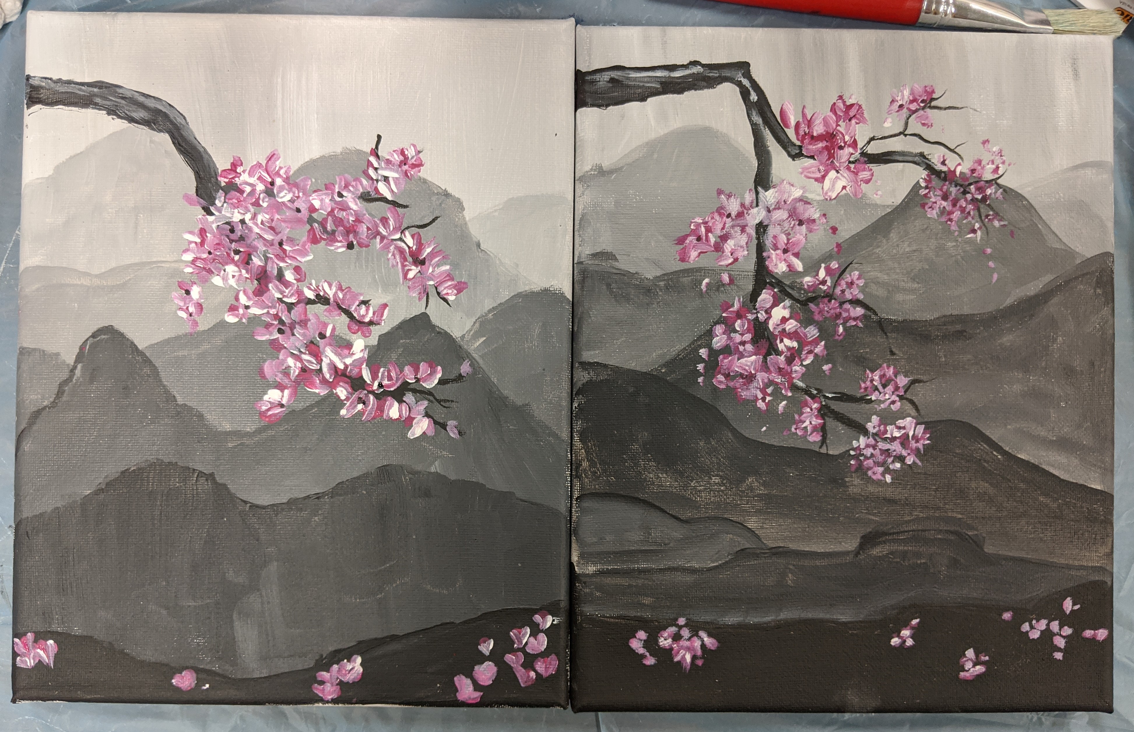 Image of a painting depicting cherry blossoms and mountains