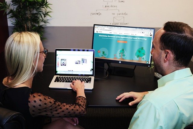 two people training on computers