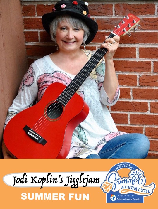 Jodi Koplin and her red guitar