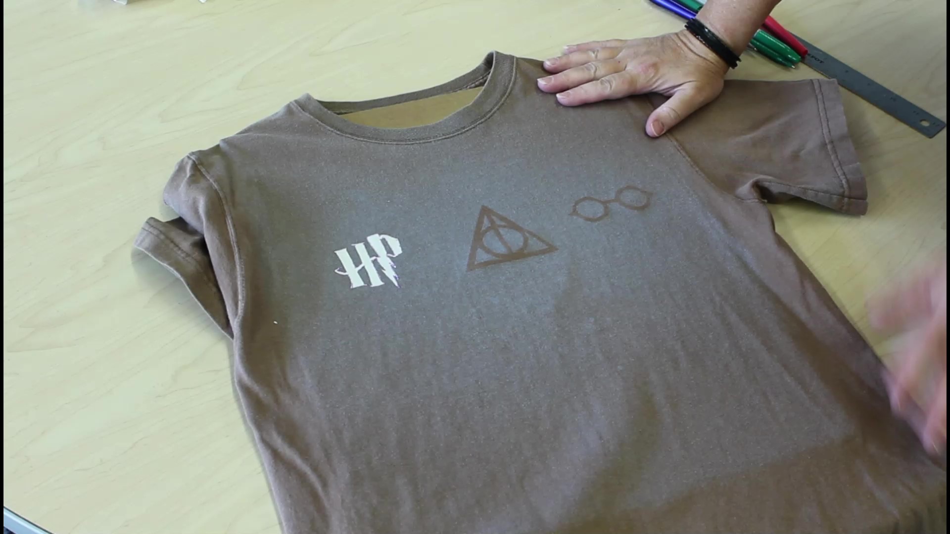 Picture of partially bleached shirt with Harry Potter designs.