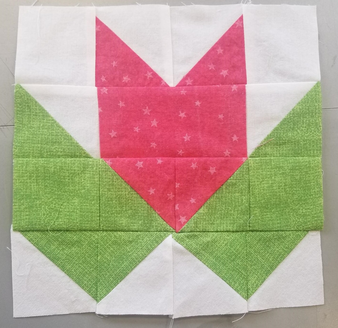 A Tea Leaf quilt block in red green and white