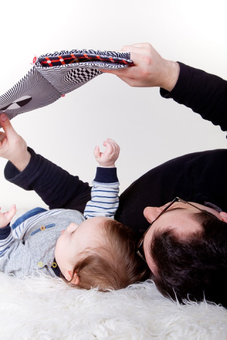 Baby and Dad share a story