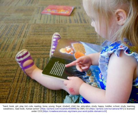 Child looking at book