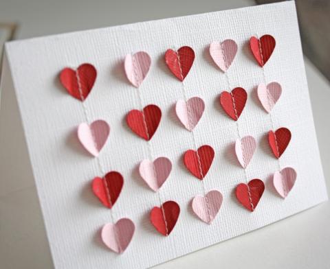 Red and pink hearts on white board