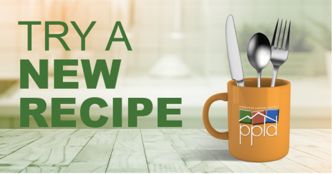 Photo of a mug with eating utensils 