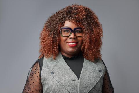 LaNette Kincaid, wearing black glasses and a grey vest over a black blouse