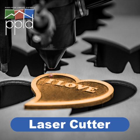 image of a laser engraving a cutting a wooden heart. PPLD Laser Cutter