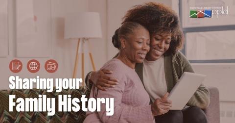 Graphic displaying text "Sharing Your Family History" with two women sitting on a couch in a living room and smiling while looking at a tablet computer in the background 