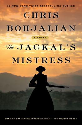 The cover shows a woman's shadowy figure in front of a mountain landscape. She is dressed in a big gown and is holding a large older looking rifle. The title of the book is written in black across the top, over some of the mountain landscape. 