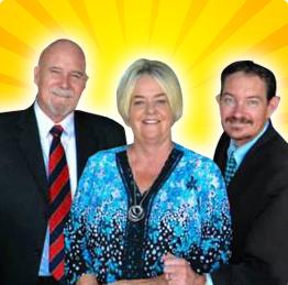 2 men in suits and 1 woman