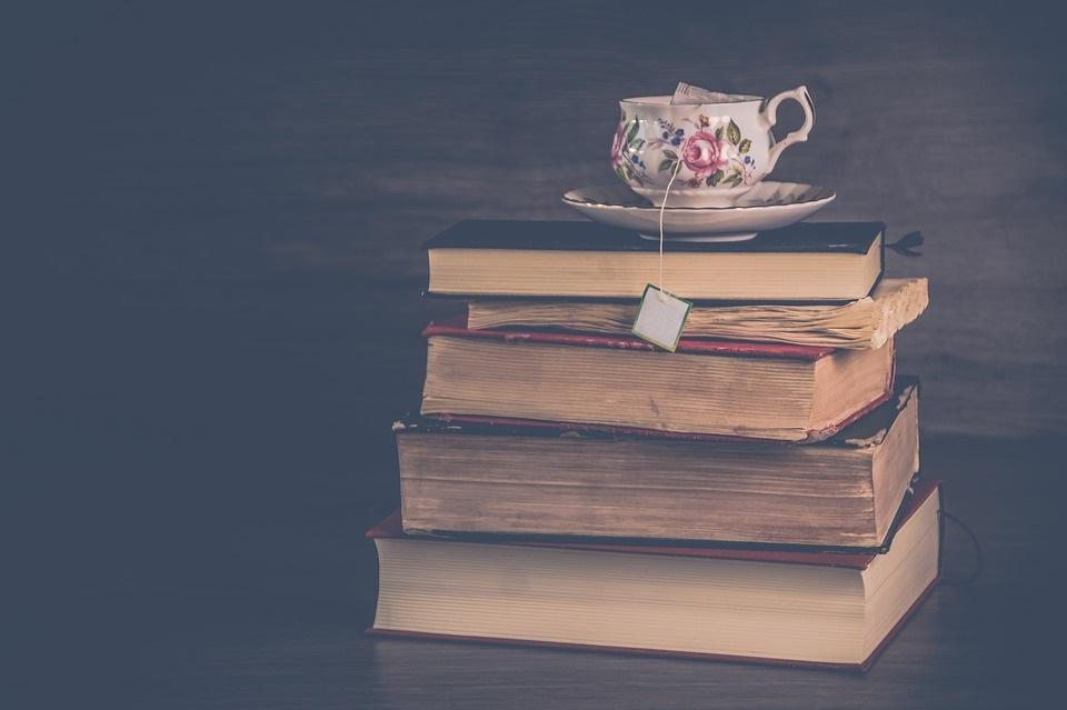 Book stack with tea cup on top